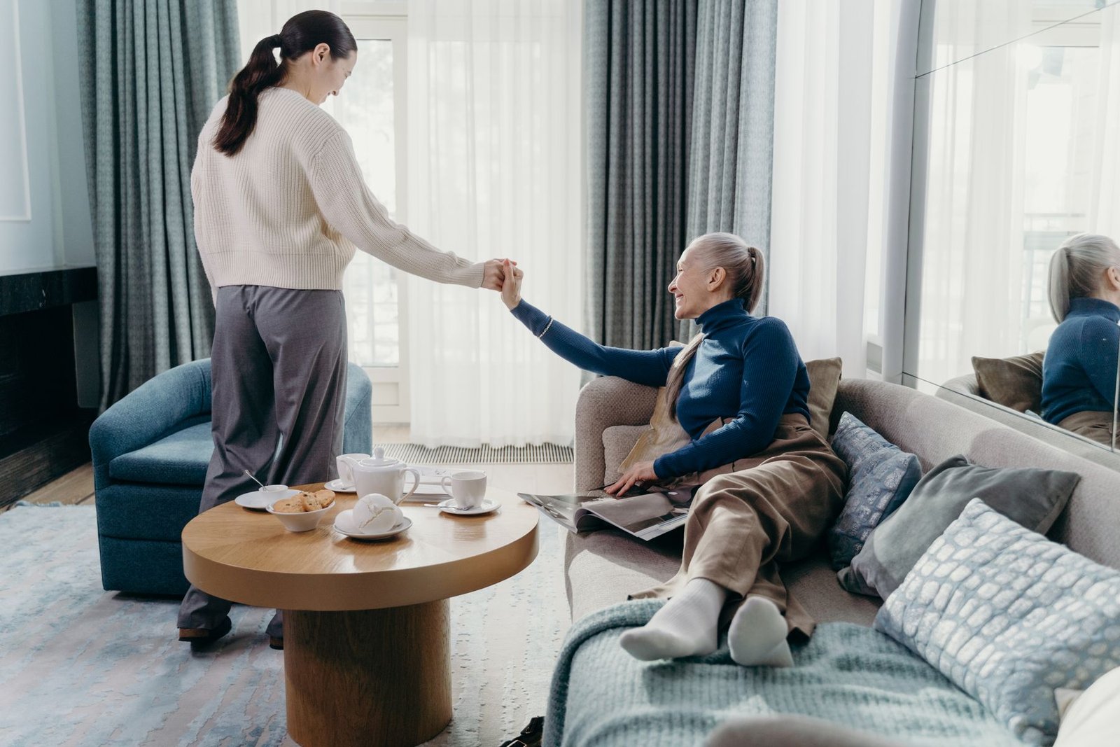 An older woman and an adult family member spending time together at home